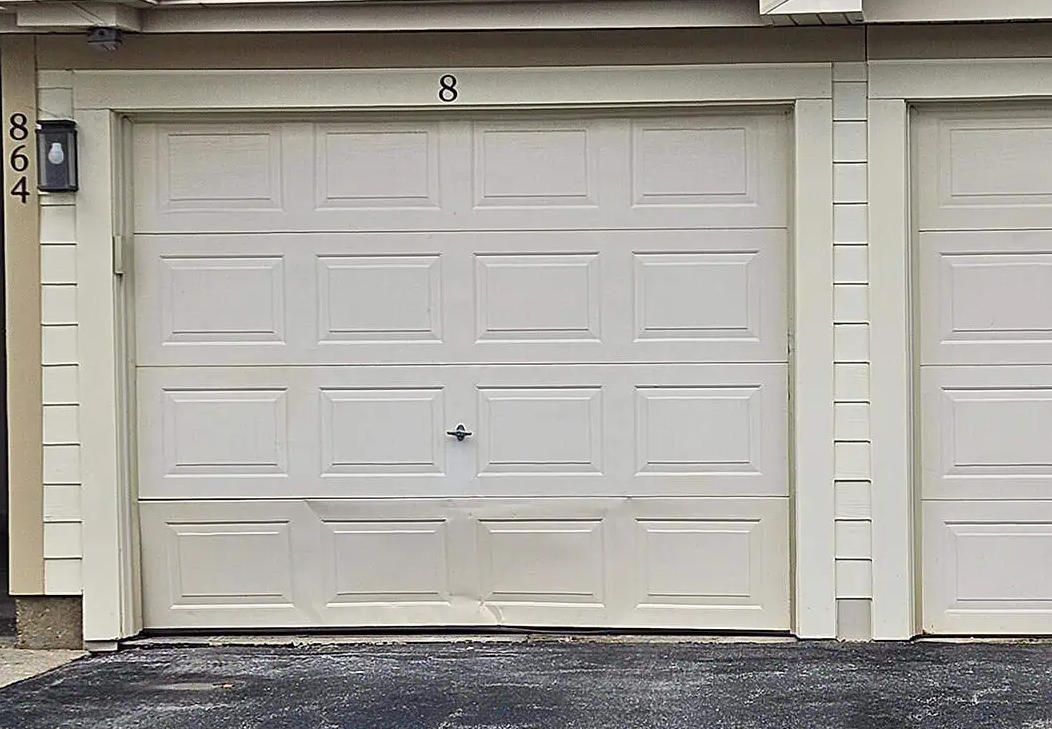 Garage door panel need repair.